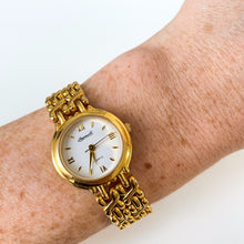 Load image into Gallery viewer, Vintage Ladies' Ingersoll Quartz Watch with Intricate Gold-Tone Bracelet and White Dial