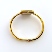 Load image into Gallery viewer, Vintage 90s Yves Saint Laurent Ladies' Bangle Style Quartz Watch with Gold-Tone Bracelet and Metallic Blue Dial