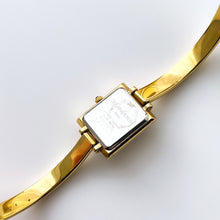Load image into Gallery viewer, Vintage 90s Yves Saint Laurent Ladies' Bangle Style Quartz Watch with Gold-Tone Bracelet and Metallic Blue Dial