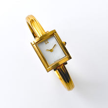 Load image into Gallery viewer, Vintage 90s Yves Saint Laurent Ladies' Bangle Style Quartz Watch with Gold-Tone Bracelet and White Mother of Pearl Dial