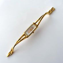 Load image into Gallery viewer, Vintage 1990s Gold-Plated Ladies' Nina Ricci Bangle Quartz Watch with Rectangular Dial