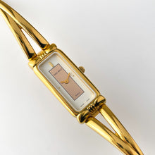Load image into Gallery viewer, Vintage 1990s Gold-Plated Ladies' Nina Ricci Bangle Quartz Watch with Rectangular Dial