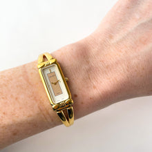 Load image into Gallery viewer, Vintage 1990s Gold-Plated Ladies' Nina Ricci Bangle Quartz Watch with Rectangular Dial