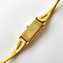 Load image into Gallery viewer, Vintage 1990s Gold-Plated Ladies' Nina Ricci Bangle Quartz Watch with Rectangular Dial