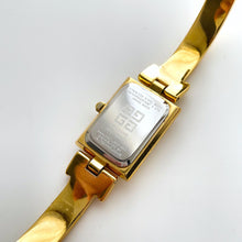 Load image into Gallery viewer, Vintage 1990s Gold-Plated Ladies' Givenchy Bangle Watch with Blue Dial and Quartz Movement
