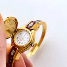 Load image into Gallery viewer, Vintage André Mouche Quartz Watch with Burgundy Enamel Floral Design, Concealead Dial and Gold-Plated Bangle Bracelet