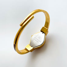 Load image into Gallery viewer, Vintage André Mouche Quartz Watch with Burgundy Enamel Floral Design, Concealead Dial and Gold-Plated Bangle Bracelet