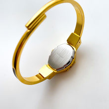 Load image into Gallery viewer, Vintage André Mouche Quartz Watch with Gold and Navy Enamel Floral Design, Concealead Dial and Gold-Plated Bangle Bracelet