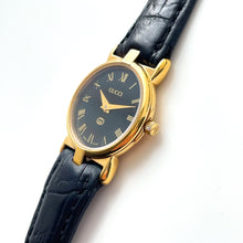 Load image into Gallery viewer, 90s Gold-Plated Ladies' Gucci Quartz Watch with Black Leather Strap - Boxed