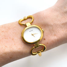 Load image into Gallery viewer, 1990s Gucci Quartz Watch with Mother of Pearl Dial and Semi Bangle Bracelet