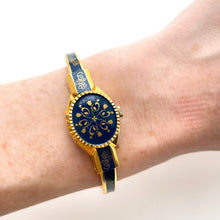 Load image into Gallery viewer, Vintage André Mouche Quartz Watch with Gold and Navy Enamel Floral Design, Concealead Dial and Gold-Plated Bangle Bracelet