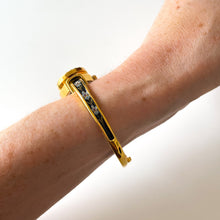 Load image into Gallery viewer, Vintage André Mouche Quartz Watch with Black and Purple Enamel Floral Design, Concealead Dial and Gold-Plated Bangle Bracelet