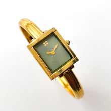 Load image into Gallery viewer, Vintage 90s Yves Saint Laurent Ladies' Bangle Style Quartz Watch with Gold-Tone Bracelet and Green Dial