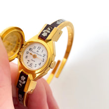 Load image into Gallery viewer, Vintage André Mouche Quartz Watch with Burgundy Enamel Floral Design, Concealead Dial and Gold-Plated Bangle Bracelet