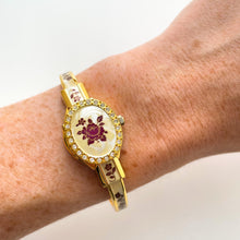 Load image into Gallery viewer, Vintage André Mouche Quartz Watch with Enamel Floral Design, Concealed Dial and Gold-Plated Bangle Bracelet
