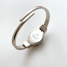 Load image into Gallery viewer, Vintage André Mouche Quartz Watch with Burgundy Enamel Floral Design, Concealed Dial and Silver-Tone Bangle Bracelet