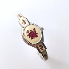 Load image into Gallery viewer, Vintage André Mouche Quartz Watch with Burgundy Enamel Floral Design, Concealed Dial and Silver-Tone Bangle Bracelet