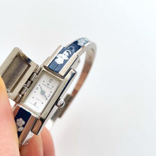 Load image into Gallery viewer, Vintage André Mouche Quartz Watch with Navy Enamel Floral Design, Concealed Dial and Stainless Steel Bangle Bracelet