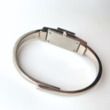 Load image into Gallery viewer, Vintage André Mouche Quartz Watch with Navy Enamel Floral Design, Concealed Dial and Stainless Steel Bangle Bracelet