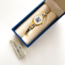 Load image into Gallery viewer, Vintage André Mouche Quartz Watch with Beige and Blue Enamel Floral Design, Concealed Dial and Gold-Plated Bangle Bracelet