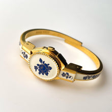 Load image into Gallery viewer, Vintage André Mouche Quartz Watch with Beige and Blue Enamel Floral Design, Concealed Dial and Gold-Plated Bangle Bracelet
