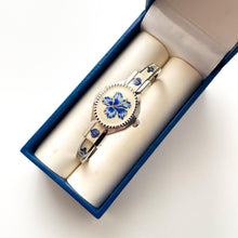 Load image into Gallery viewer, Vintage André Mouche Quartz Watch with Beige and Blue Enamel Floral Design, Concealed Dial and Stainless Steel Bangle Bracelet