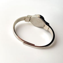 Load image into Gallery viewer, Vintage André Mouche Quartz Watch with Beige and Blue Enamel Floral Design, Concealed Dial and Stainless Steel Bangle Bracelet