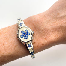 Load image into Gallery viewer, Vintage André Mouche Quartz Watch with Beige and Blue Enamel Floral Design, Concealed Dial and Stainless Steel Bangle Bracelet