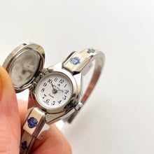 Load image into Gallery viewer, Vintage André Mouche Quartz Watch with Beige and Blue Enamel Floral Design, Concealed Dial and Stainless Steel Bangle Bracelet