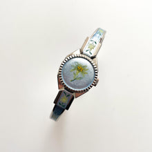 Load image into Gallery viewer, Vintage 1998 André Mouche Quartz Watch with Light Blue Enamel Floral Design, Concealed Dial and Silver-Tone Bangle Bracelet