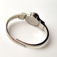 Load image into Gallery viewer, Vintage 1998 André Mouche Quartz Watch with Light Blue Enamel Floral Design, Concealed Dial and Silver-Tone Bangle Bracelet