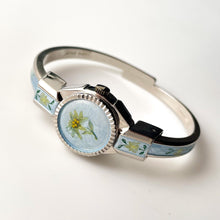 Load image into Gallery viewer, Vintage 1998 André Mouche Quartz Watch with Light Blue Enamel Floral Design, Concealed Dial and Silver-Tone Bangle Bracelet