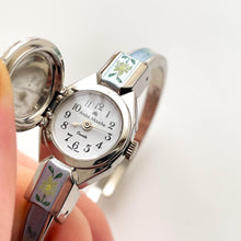 Load image into Gallery viewer, Vintage 1998 André Mouche Quartz Watch with Light Blue Enamel Floral Design, Concealed Dial and Silver-Tone Bangle Bracelet