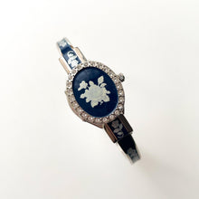 Load image into Gallery viewer, Vintage André Mouche Quartz Watch with Navy Enamel Floral Design, Concealed Dial and Silver-Tone Bangle Bracelet