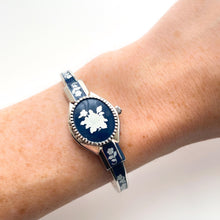 Load image into Gallery viewer, Vintage André Mouche Quartz Watch with Navy Enamel Floral Design, Concealed Dial and Silver-Tone Bangle Bracelet