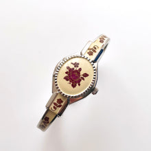 Load image into Gallery viewer, Vintage André Mouche Quartz Watch with Burgundy Enamel Floral Design, Concealed Dial and Silver-Tone Bangle Bracelet