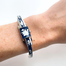 Load image into Gallery viewer, Vintage André Mouche Quartz Watch with Navy Enamel Floral Design, Concealed Dial and Stainless Steel Bangle Bracelet