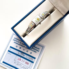 Load image into Gallery viewer, Vintage 1999 André Mouche Quartz Watch with Enamel Floral Design, Concealed Dial and Stainless Steel Bangle Bracelet