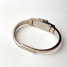 Load image into Gallery viewer, Vintage 1999 André Mouche Quartz Watch with Enamel Floral Design, Concealed Dial and Stainless Steel Bangle Bracelet