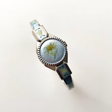 Load image into Gallery viewer, Vintage 1998 André Mouche Quartz Watch with Light Blue Enamel Floral Design, Concealed Dial and Silver-Tone Bangle Bracelet