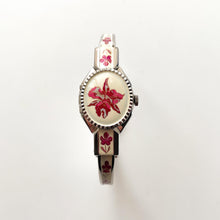 Load image into Gallery viewer, Vintage 1999 André Mouche Quartz Watch with Pink Enamel Floral Design, Concealed Dial and Silver-Tone Bangle Bracelet
