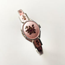 Load image into Gallery viewer, Vintage 1990s André Mouche Quartz Watch with Pink & Burgundy Enamel Floral Design, Concealed Dial and Silver-Tone Bangle Bracelet