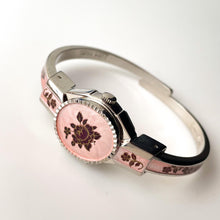 Load image into Gallery viewer, Vintage 1990s André Mouche Quartz Watch with Pink & Burgundy Enamel Floral Design, Concealed Dial and Silver-Tone Bangle Bracelet