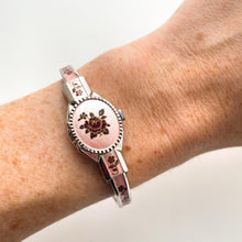 Load image into Gallery viewer, Vintage 1990s André Mouche Quartz Watch with Pink & Burgundy Enamel Floral Design, Concealed Dial and Silver-Tone Bangle Bracelet
