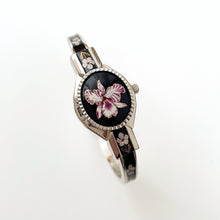Load image into Gallery viewer, Vintage André Mouche Quartz Watch with Black & Purple Enamel Floral Design, Concealed Dial and Silver-Tone Bangle Bracelet