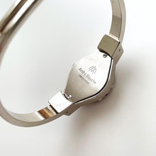 Load image into Gallery viewer, Vintage André Mouche Quartz Watch with Black & Purple Enamel Floral Design, Concealed Dial and Silver-Tone Bangle Bracelet