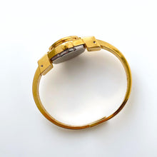 Load image into Gallery viewer, Vintage Quartz Watch with Black and Green Enamel Floral Design, Concealed Dial and Gold-Plated Bangle Bracelet