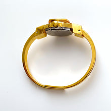 Load image into Gallery viewer, Vintage André Mouche Quartz Watch with Burgundy Enamel Floral Design, Concealead Dial and Gold-Plated Bangle Bracelet