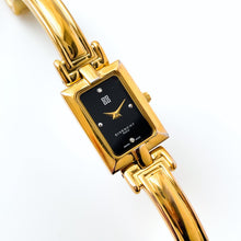 Load image into Gallery viewer, Givenchy Millésime – Gold-Plated Quartz Bangle Watch with Black Dial, 1990s