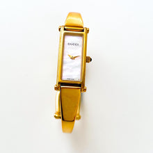 Load image into Gallery viewer, Vintage 1990s Ladies' Gold-Plated Gucci 1500L Bangle Quartz Watch with Rectangular Mother of Pearl Dial - Boxed